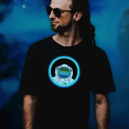 Man wearing sunglasses and an astronaut equalizer light up shirt that animates to sound and music