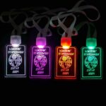 Four Star Wars themed custom engraved LED badges illuminating in white, pink, red and green