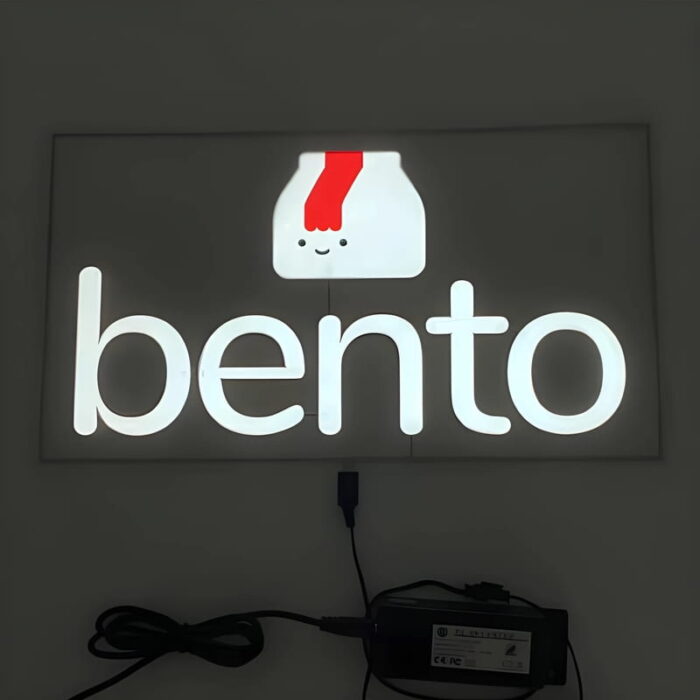 Bento box logo and text glowing brightly for el poster