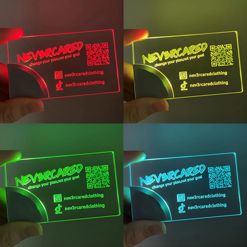 Grid of four pictures showing the same laser engraved print on acrylic LED business cards, each lighting up a different color