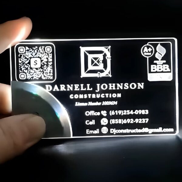 Construction logo on LED business card shining bright white