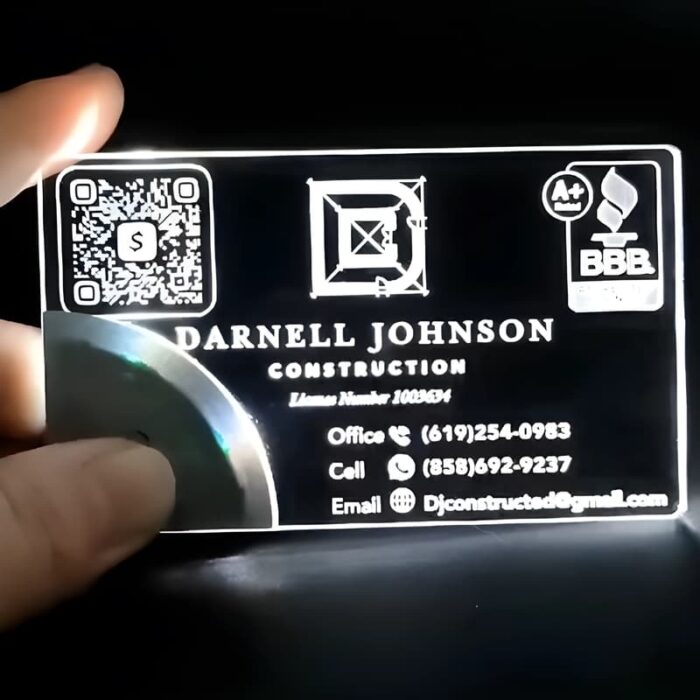 Construction logo on LED business card shining bright white
