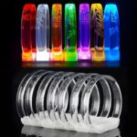 seven different style fonts and logos laser engraved onto LED bracelets, top half of photo showing the bracelets on and lighting up different colors, bottom half showing the same bracelets off and are clear