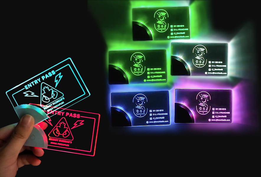 A person holds an illuminated LED business card, showcasing its bright design and unique features