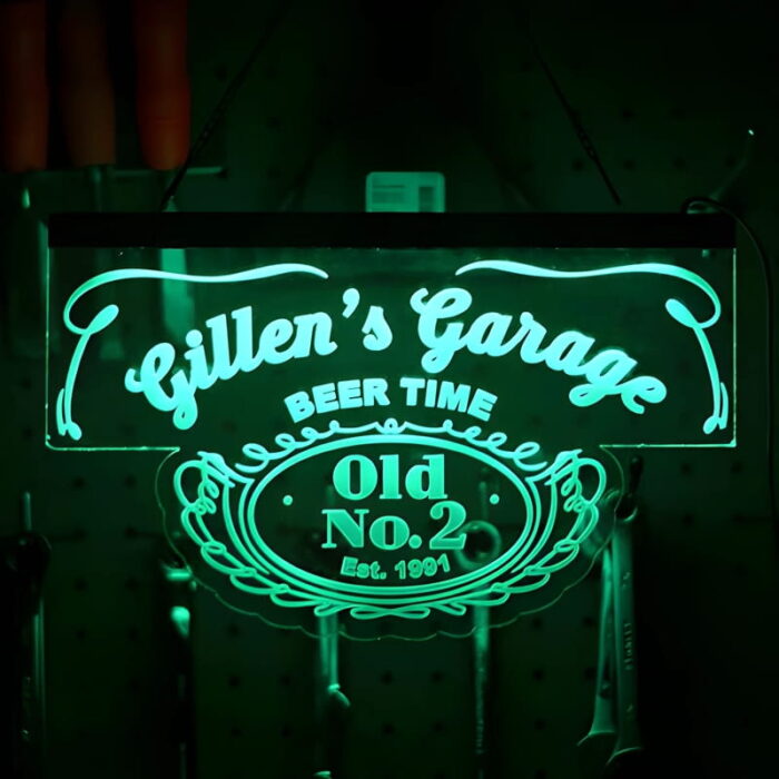 Gillen's Garage custom designed bar neon sign on acrylic glowing green