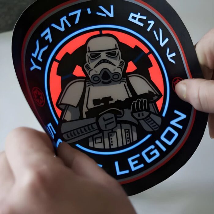 Storm trooper design on EL panel lighting up while someone bends the material