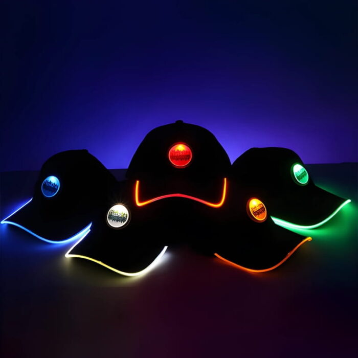 Five hats with glowing brims in blue, white, red, orange, and green, each displaying a logo and illuminated by LED lights