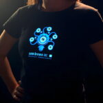 Girl posing with hands on hips wearing a personalized healthcare lighted t-shirt