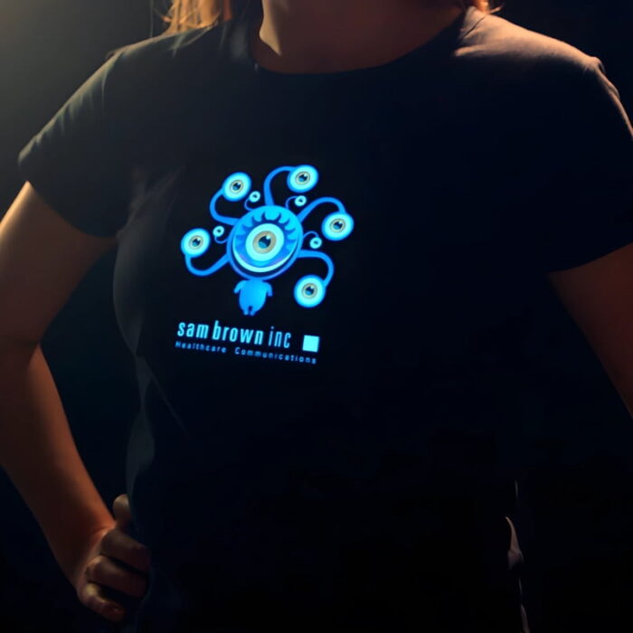 Girl posing with hands on hips wearing a personalized healthcare lighted t-shirt