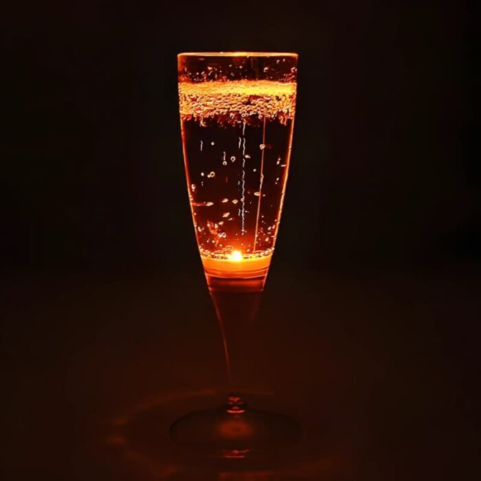 Orange LED champagne flute lighting up bright orange