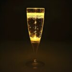 LED champagne glass lighting up bright yellow
