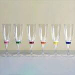 Line of LED champagne glasses turned off, with color strip visible