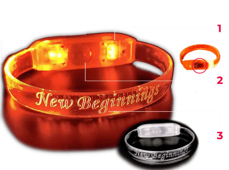 Diagram of an orange LED bracelet inscribed with "New Beginnings," showcasing how the light-up feature operates.