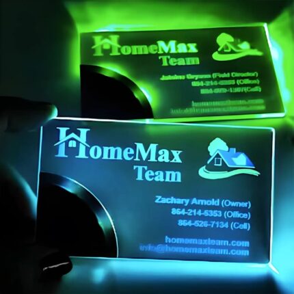 A person holds a glowing business card, showcasing its illuminated design and innovative features.