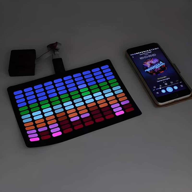 equalizer design on el panel with phone next to it to show it lights up to sound and music