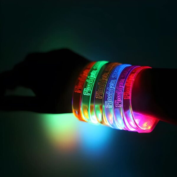 A close-up of a person wearing 6 brightly lit up bracelets, featuring multiple LED glowing colors.