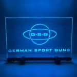 Bright blue LED sign display for German Sport Guns at a business event