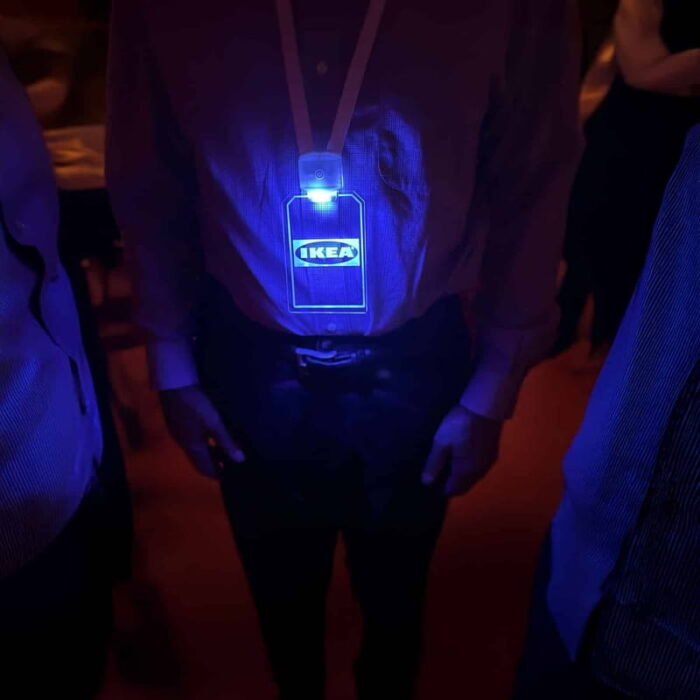A man wearing a lanyard with a blue Lighted badge featuring Ikea branded logo