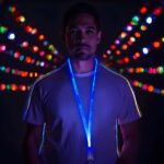 Man wearing custom engraved led lanyard glowing neon blue
