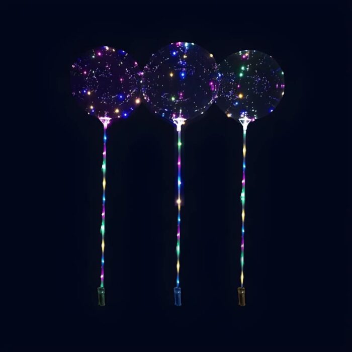 Three light up clear balloons in multi colored LED's, each held by a stick
