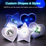 LED light pins in various custom heart shapes, glowing brightly in a vibrant display of colors.