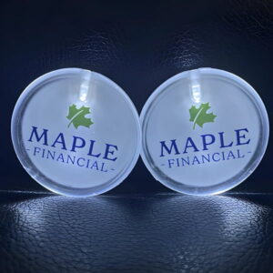 Two custom led pins side by side with Maple Financial logo glowing brightly