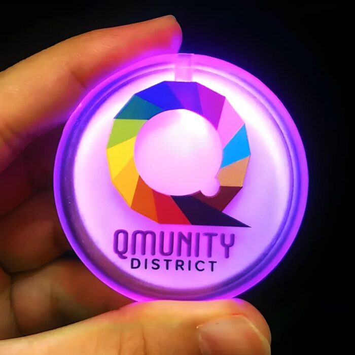 Qmunity District rainbow Q logo printed on pink LED pin