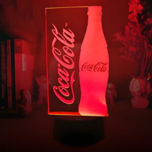Coca-Cola branded logo lighting up on custom acrylic sign