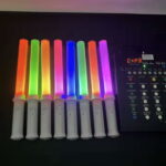 A collection of colorful LED wand sticks with remote control