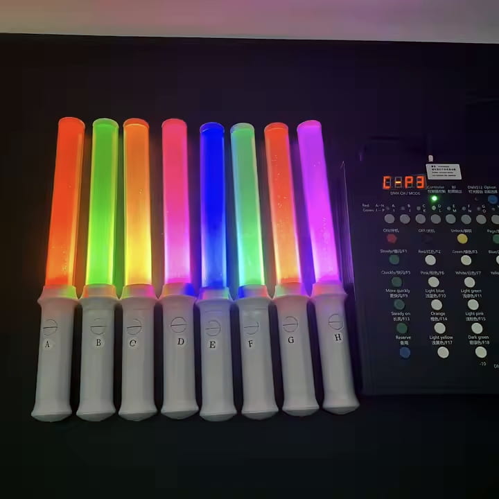 A collection of colorful LED wand sticks with remote control