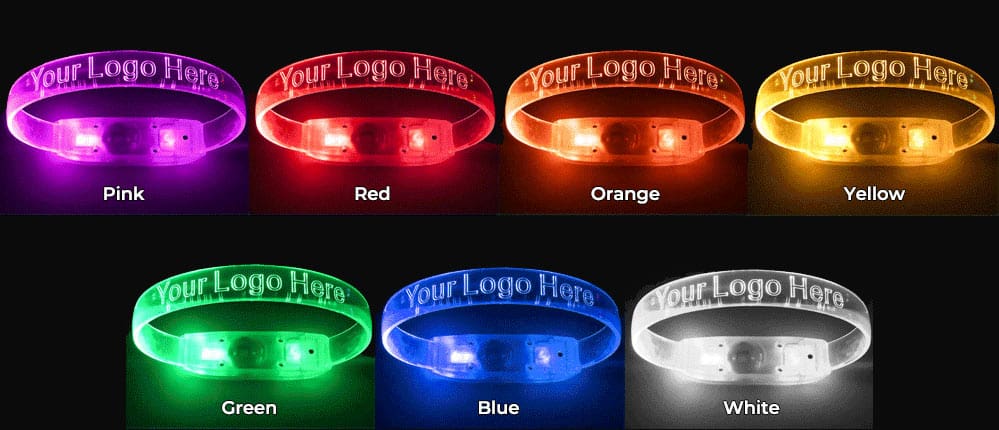 Promotional LED wristbands displaying seven color options: pink, red, orange, yellow, green, blue, and white.