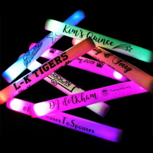 Various LED foam sticks with custom logos lighting up rainbow of colors