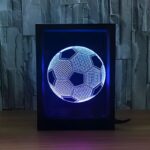 A 3D engraved soccer ball in a black frame illuminated by a blue LED light, showcasing a unique sports gift