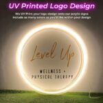 Neon sign with Level Up logo UV printed onto acrylic for wellness and physical therapy business