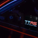 TT ride share logo glowing on el car sticker window
