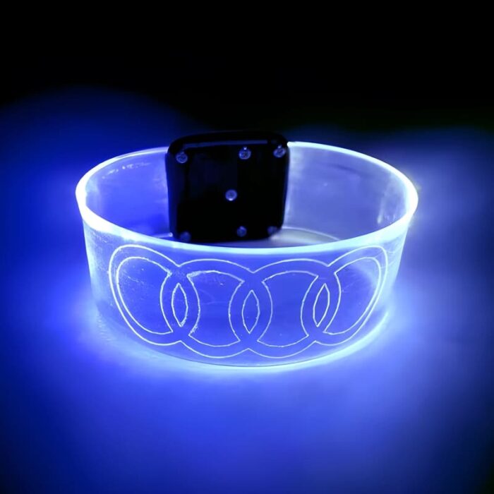 Bright blue glowing wristband with audi logo laser engraved