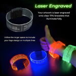 Pictures of laser engraving on clear TPU wristbands shown off and powered on glowing bright neon colors