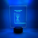 A blue LED lamp with "Galaxy Pro" written on it, glowing in a dark setting