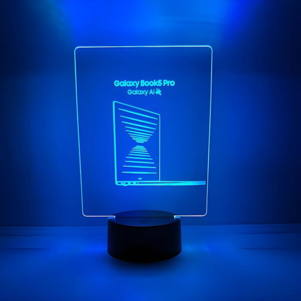 A blue LED lamp with "Galaxy Pro" written on it, glowing in a dark setting