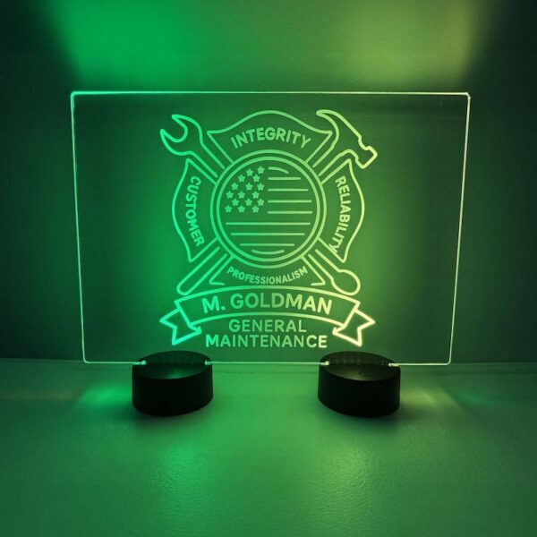 Bright green sign that says "Mr. Goldman Maintenance," designed with custom LED acrylic and personalized engraving