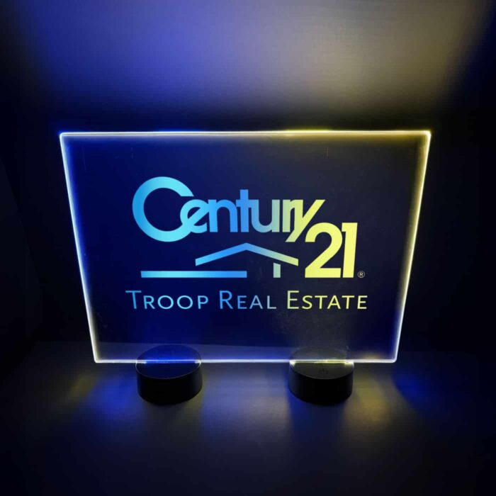 Bright LED acrylic sign for Century 21 real estate, showcasing blue and yellow lights designed for table display