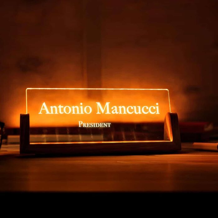 LED acrylic name plate featuring a custom name and title in an office