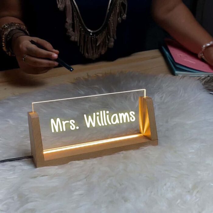 Personalized LED acrylic plaque with a teacher's name, designed as a unique desk sign gift for a teacher