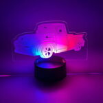 A truck-shaped LED light up acrylic sign in purple and pink colors