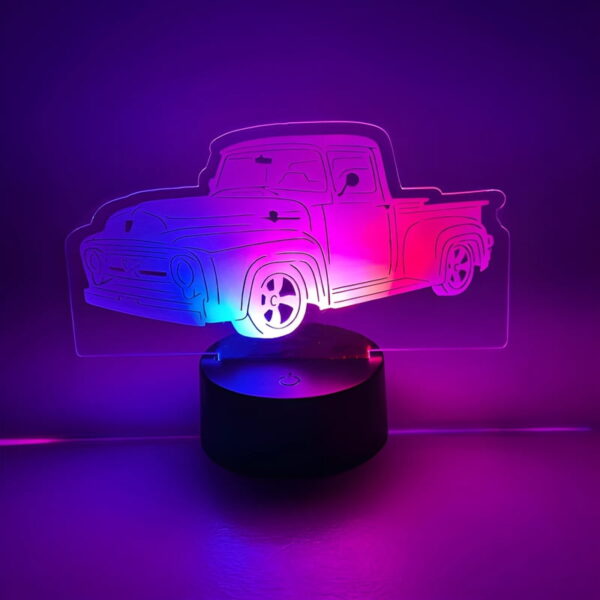 A truck-shaped LED light up acrylic sign in purple and pink colors