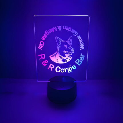 A dog in purple light with "r r corgis," highlighting a custom LED lamp for pets