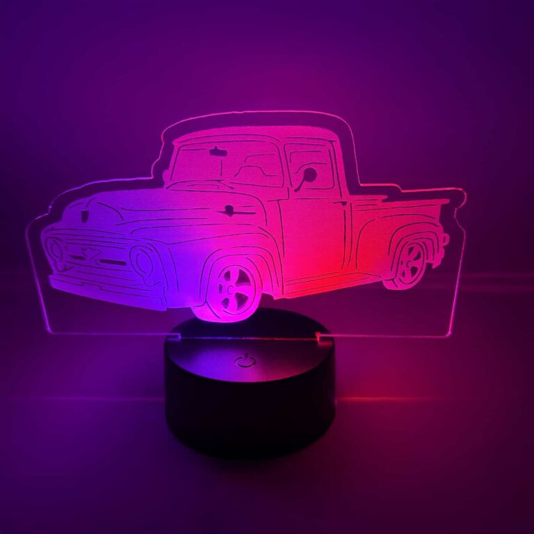 A pink and red dual colored led acrylic sign engraved and shaped like a model truck