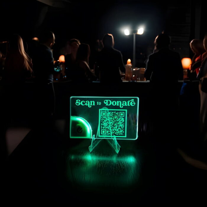 Scan to donate QR code on a light up acrylic card display