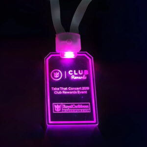 Royal Caribbean Custom LED Badge design lighting up very bright hot pink in dark setting