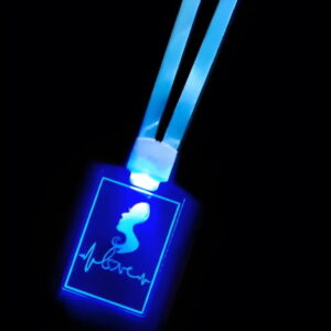 female logo engraved onto id badge lighting up